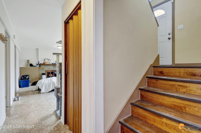 3223 Madison Way, Anchorage, AK 99508 - stairway with a lit fireplace