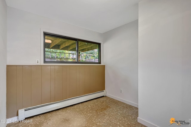 3223 Madison Way, Anchorage, AK 99508 - spare room with baseboard heating and a wainscoted wall