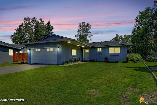 4800 Carousel Cir, Anchorage, AK 99502 - ranch-style house with an attached garage, concrete driveway, and board and batten siding