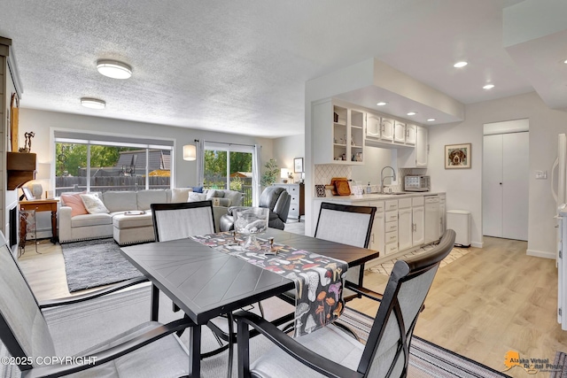 4800 Carousel Cir, Anchorage, AK 99502 - dining space featuring plenty of natural light, light wood finished floors, and recessed lighting