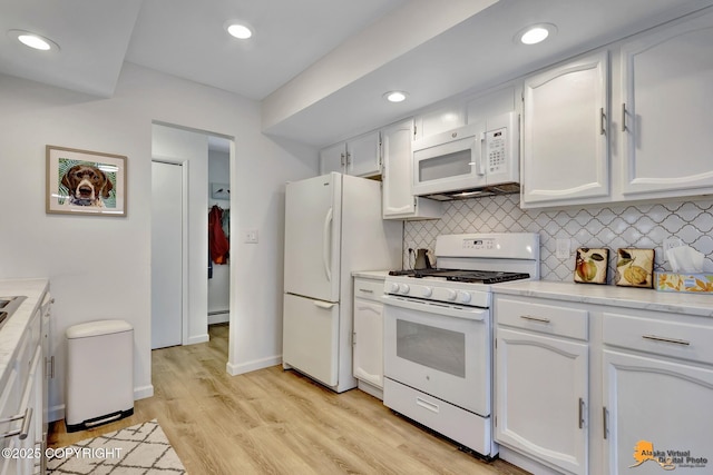 4800 Carousel Cir, Anchorage, AK 99502 - kitchen with white appliances, backsplash, white cabinetry, baseboard heating, and recessed lighting
