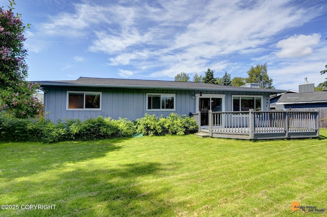 4800 Carousel Cir, Anchorage, AK 99502 - rear view of property featuring a deck, a yard, and board and batten siding