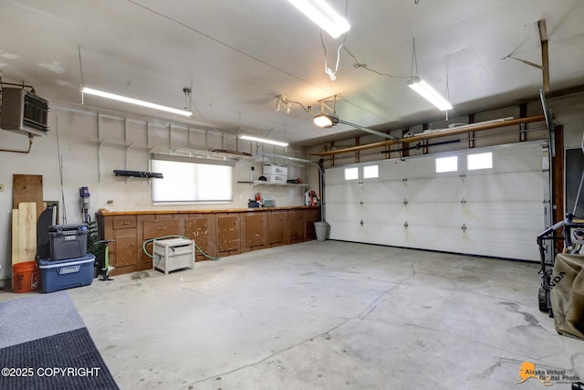4800 Carousel Cir, Anchorage, AK 99502 - garage with a garage door opener and a heating unit