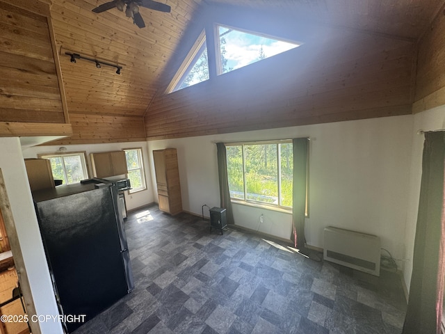 21577 Evelyn May St, Kasilof, AK 99610 - unfurnished living room with plenty of natural light, ceiling fan, wooden ceiling, high vaulted ceiling, and heating unit