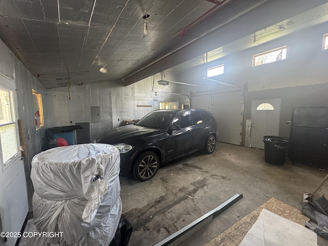 21577 Evelyn May St, Kasilof, AK 99610 - garage featuring electric panel and a garage door opener