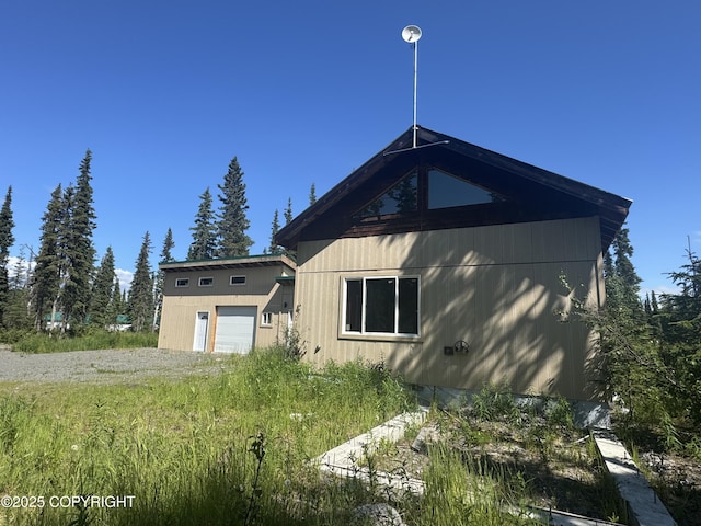 21577 Evelyn May St, Kasilof, AK 99610 - view of side of property with a garage