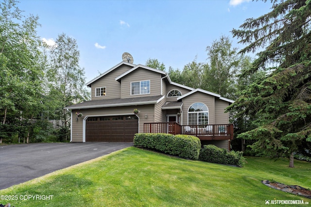 2943 Kingfisher Dr, Anchorage, AK 99502 - view of front of home featuring a garage, a front yard, driveway, and a wooden deck