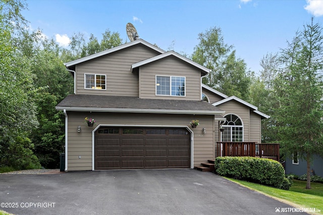 2943 Kingfisher Dr, Anchorage, AK 99502 - view of front of home with a garage, driveway, and roof with shingles