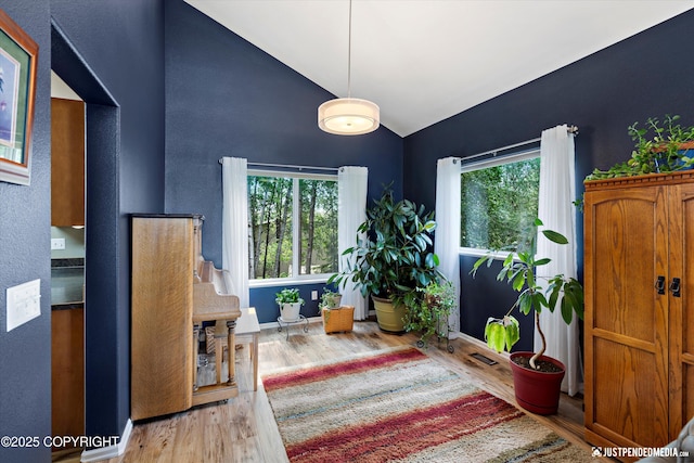 2943 Kingfisher Dr, Anchorage, AK 99502 - sitting room with wood finished floors and high vaulted ceiling