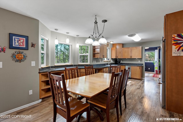 2943 Kingfisher Dr, Anchorage, AK 99502 - dining room with light wood-style floors and baseboards