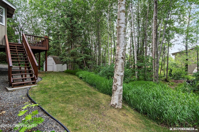 2943 Kingfisher Dr, Anchorage, AK 99502 - view of green lawn featuring stairs, a storage shed, and a deck
