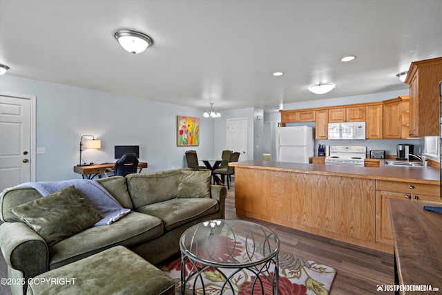 1786 E Neil Cir # 4, Wasilla, AK 99654 - living area featuring a chandelier, dark wood finished floors, a desk, and recessed lighting