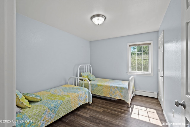 1786 E Neil Cir # 4, Wasilla, AK 99654 - bedroom featuring a baseboard radiator and wood finished floors