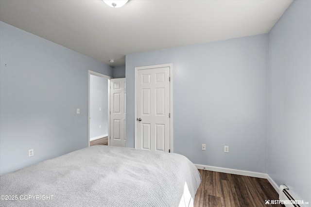 1786 E Neil Cir # 4, Wasilla, AK 99654 - bedroom with baseboard heating and dark wood finished floors