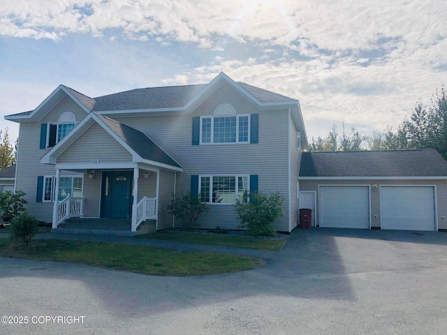1786 E Neil Cir # 4, Wasilla, AK 99654 - view of front of home with a porch, asphalt driveway, and an attached garage
