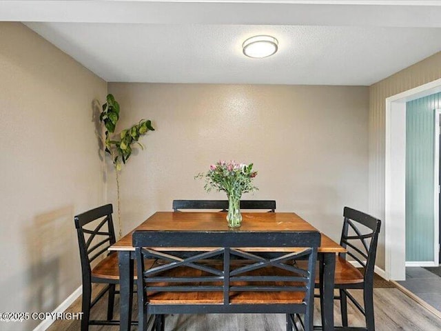 72155 Shannon Rd, Anchor Point, AK 99556 - dining area with wood finished floors and baseboards