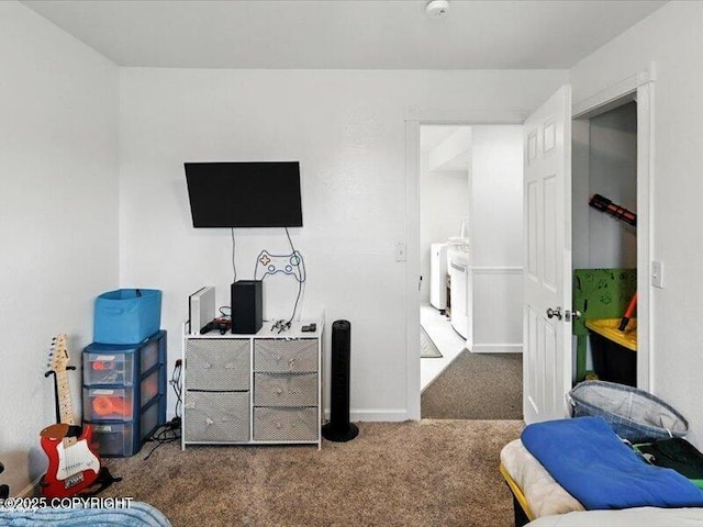 72155 Shannon Rd, Anchor Point, AK 99556 - bedroom featuring washing machine and clothes dryer and carpet floors