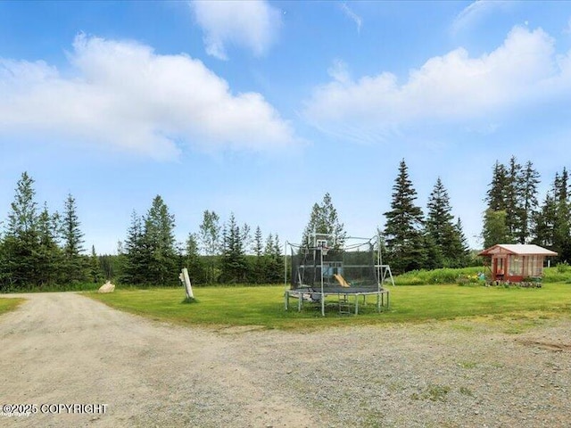 72155 Shannon Rd, Anchor Point, AK 99556 - view of grassy yard featuring a trampoline