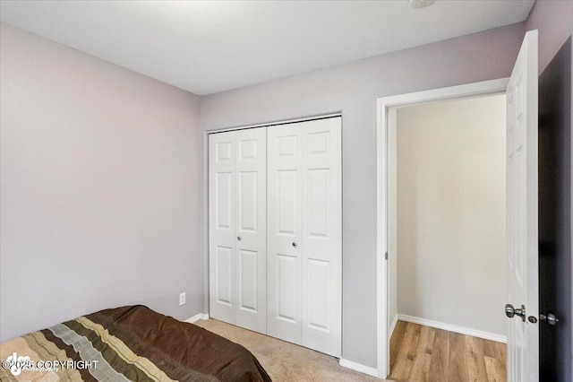 2608 Lauren Creek Loop # 4, Anchorage, AK 99507 - bedroom with baseboards and a closet