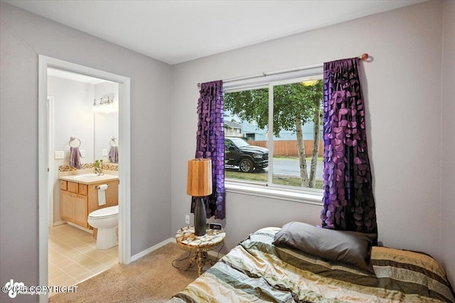 2608 Lauren Creek Loop # 4, Anchorage, AK 99507 - bedroom with light colored carpet and connected bathroom