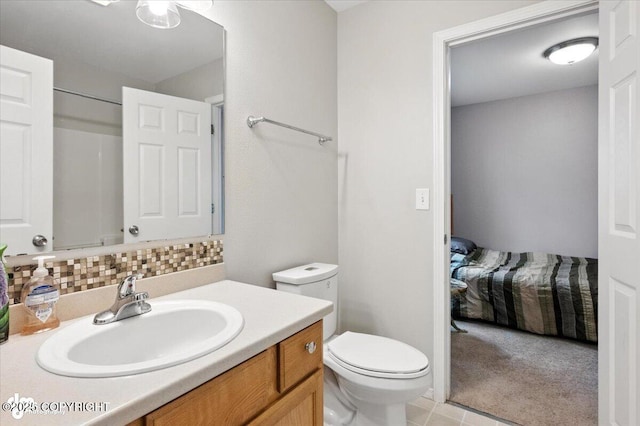 2608 Lauren Creek Loop # 4, Anchorage, AK 99507 - full bath featuring vanity, decorative backsplash, tile patterned flooring, and a shower