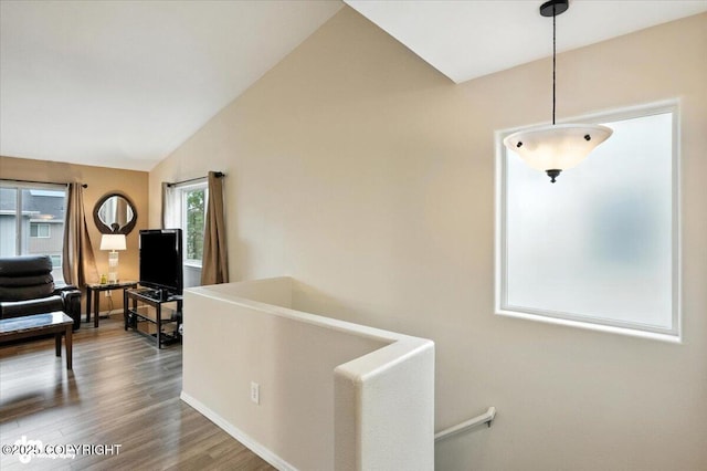 2608 Lauren Creek Loop # 4, Anchorage, AK 99507 - corridor with vaulted ceiling, wood finished floors, and an upstairs landing
