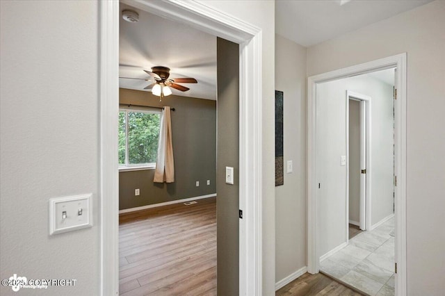 2608 Lauren Creek Loop # 4, Anchorage, AK 99507 - hall featuring baseboards and wood finished floors