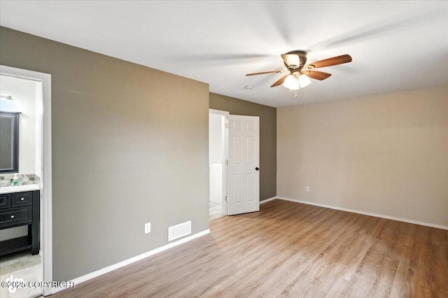 2608 Lauren Creek Loop # 4, Anchorage, AK 99507 - spare room featuring a ceiling fan and light wood finished floors