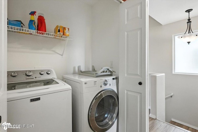 2608 Lauren Creek Loop # 4, Anchorage, AK 99507 - laundry area featuring washing machine and dryer and light wood-style flooring