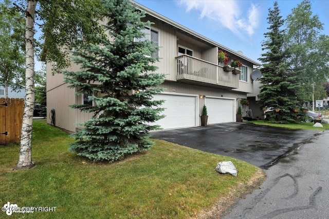 2608 Lauren Creek Loop # 4, Anchorage, AK 99507 - view of front of property with asphalt driveway, a balcony, an attached garage, and a front yard