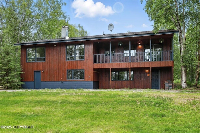 3291 N Edgewater Dr, Wasilla, AK 99623 - back of property with a lawn and a chimney