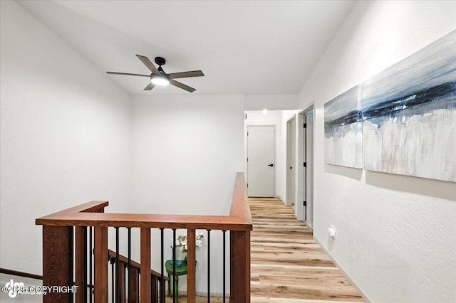 3291 N Edgewater Dr, Wasilla, AK 99623 - hallway with light wood-style flooring and an upstairs landing