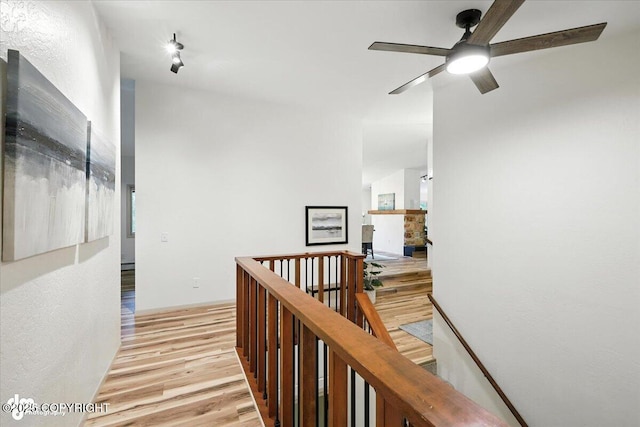 3291 N Edgewater Dr, Wasilla, AK 99623 - hallway with an upstairs landing and light wood-style flooring