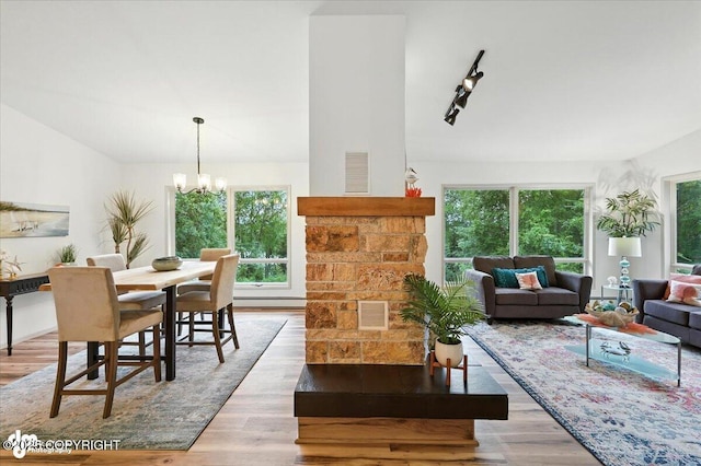 3291 N Edgewater Dr, Wasilla, AK 99623 - living room featuring plenty of natural light, wood finished floors, and a chandelier