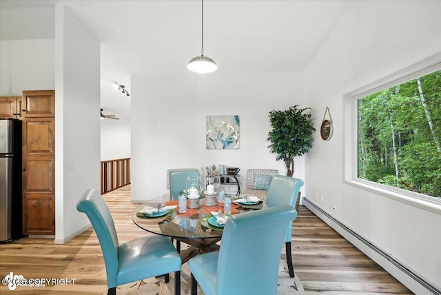 3291 N Edgewater Dr, Wasilla, AK 99623 - dining area featuring baseboard heating and light wood-style flooring