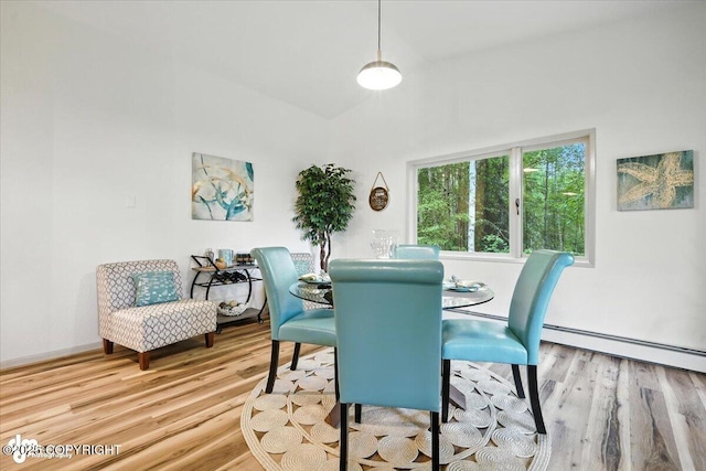 3291 N Edgewater Dr, Wasilla, AK 99623 - dining area featuring wood finished floors and a baseboard radiator