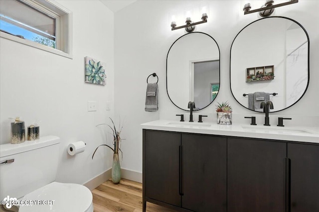 3291 N Edgewater Dr, Wasilla, AK 99623 - bathroom with double vanity and wood finished floors