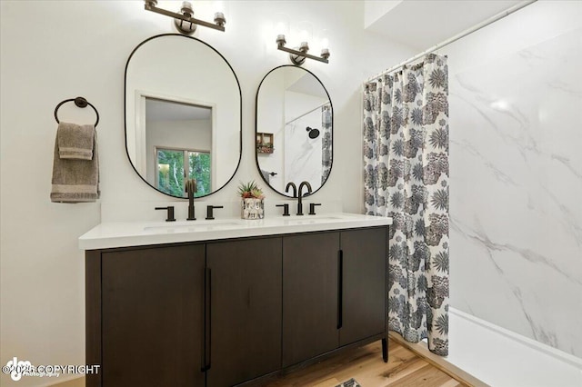 3291 N Edgewater Dr, Wasilla, AK 99623 - full bath featuring double vanity, a shower with shower curtain, and wood finished floors