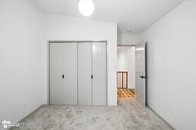 3291 N Edgewater Dr, Wasilla, AK 99623 - unfurnished bedroom featuring carpet flooring and a closet