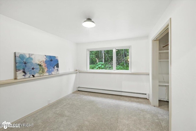 3291 N Edgewater Dr, Wasilla, AK 99623 - carpeted empty room with a baseboard heating unit