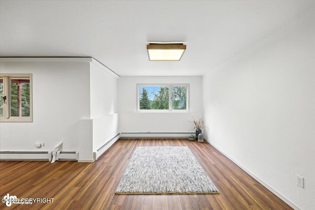3291 N Edgewater Dr, Wasilla, AK 99623 - unfurnished room with a baseboard heating unit and wood finished floors