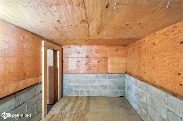 3291 N Edgewater Dr, Wasilla, AK 99623 - empty room featuring wood ceiling, wood finished floors, and concrete block wall