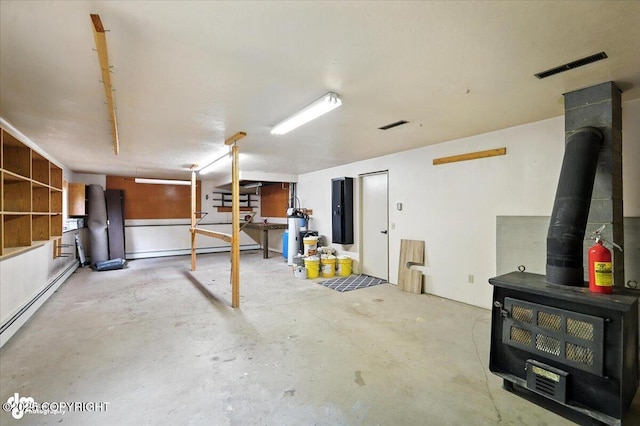3291 N Edgewater Dr, Wasilla, AK 99623 - basement with a wood stove and baseboard heating