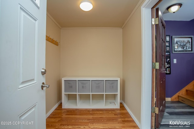 14327 E Birch Cir, Talkeetna, AK 99676 - hallway featuring wood finished floors, crown molding, and stairway