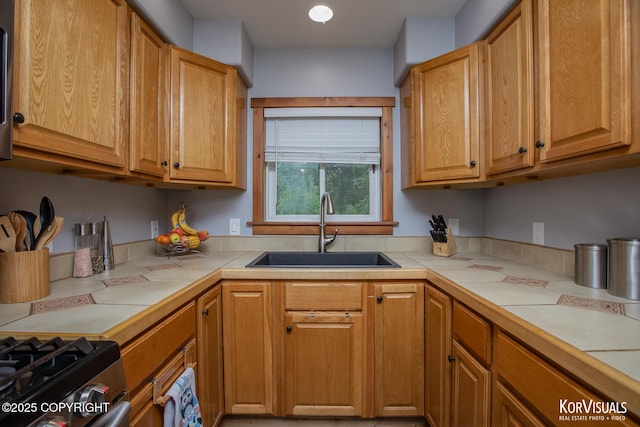 14327 E Birch Cir, Talkeetna, AK 99676 - kitchen with tile countertops and stainless steel gas stove