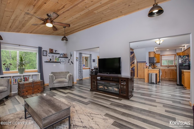 14327 E Birch Cir, Talkeetna, AK 99676 - living area featuring wood ceiling, light wood-type flooring, lofted ceiling, and ceiling fan