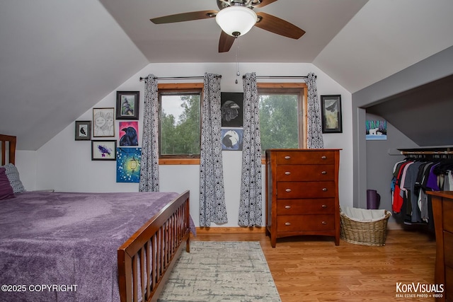 14327 E Birch Cir, Talkeetna, AK 99676 - bedroom with lofted ceiling, wood finished floors, ceiling fan, a walk in closet, and a closet