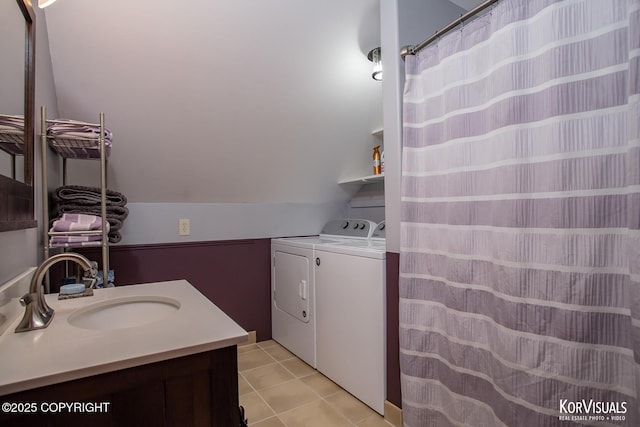14327 E Birch Cir, Talkeetna, AK 99676 - bathroom with washer and dryer, vanity, lofted ceiling, and tile patterned floors