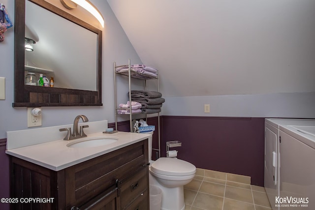 14327 E Birch Cir, Talkeetna, AK 99676 - bathroom with washer and clothes dryer, vanity, lofted ceiling, and tile patterned floors