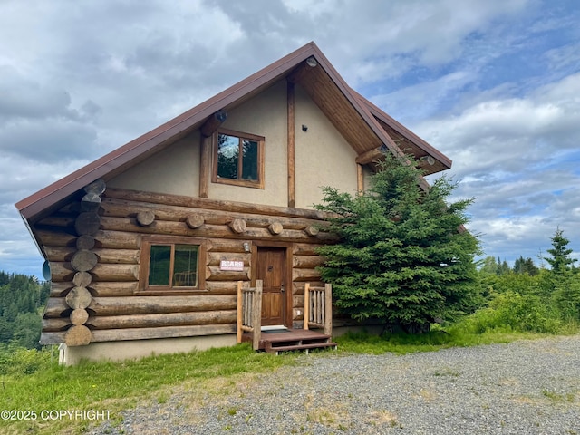 28180 Coastal Vista Cir, Anchor Point, AK 99556 - view of front of home featuring log exterior and stucco siding